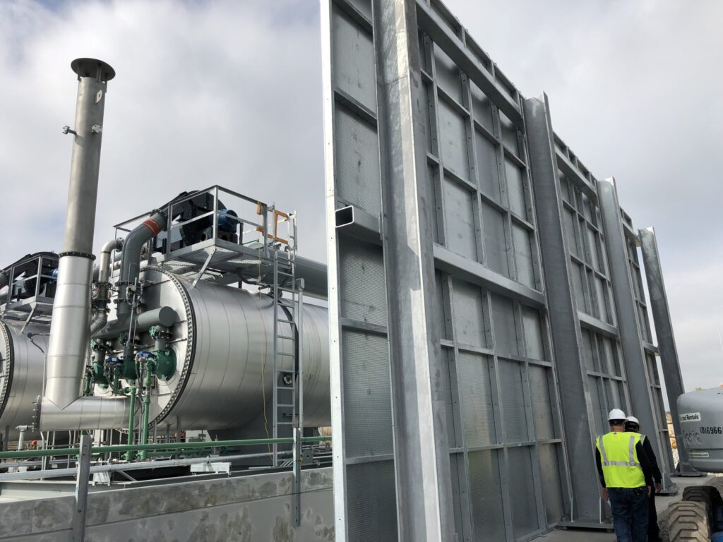a transformer fire barrier set up next to a substation transformer