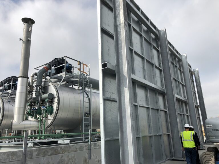 a transformer fire barrier set up next to a substation transformer